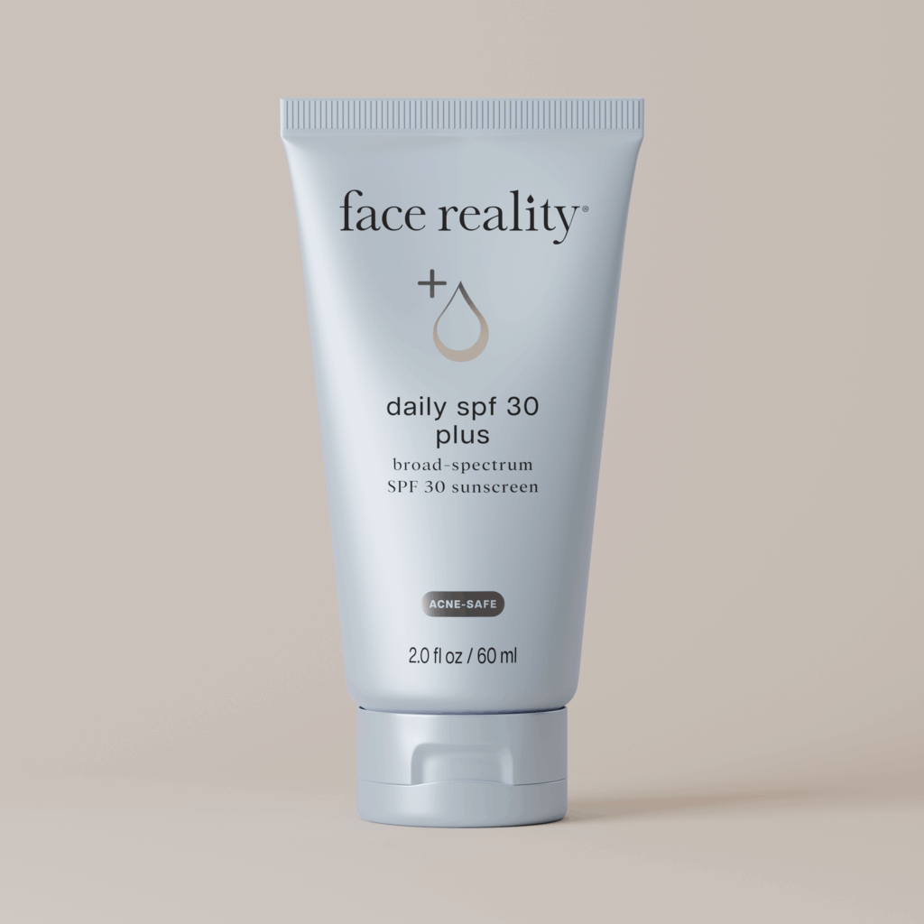 tube of face reality daily spf 30 plus sunscreen on a beige background 2