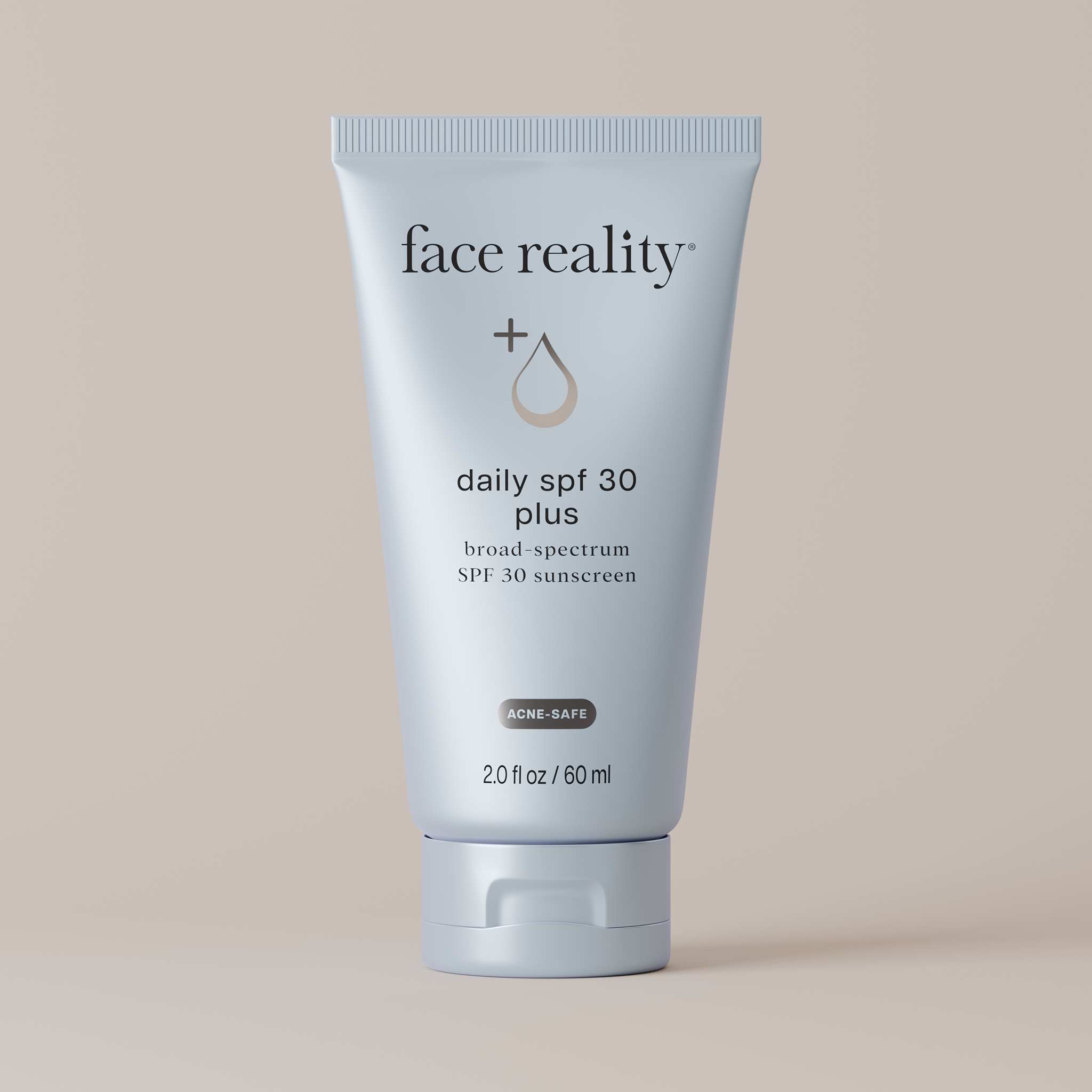 tube of face reality daily spf 30 plus sunscreen on a beige background 2